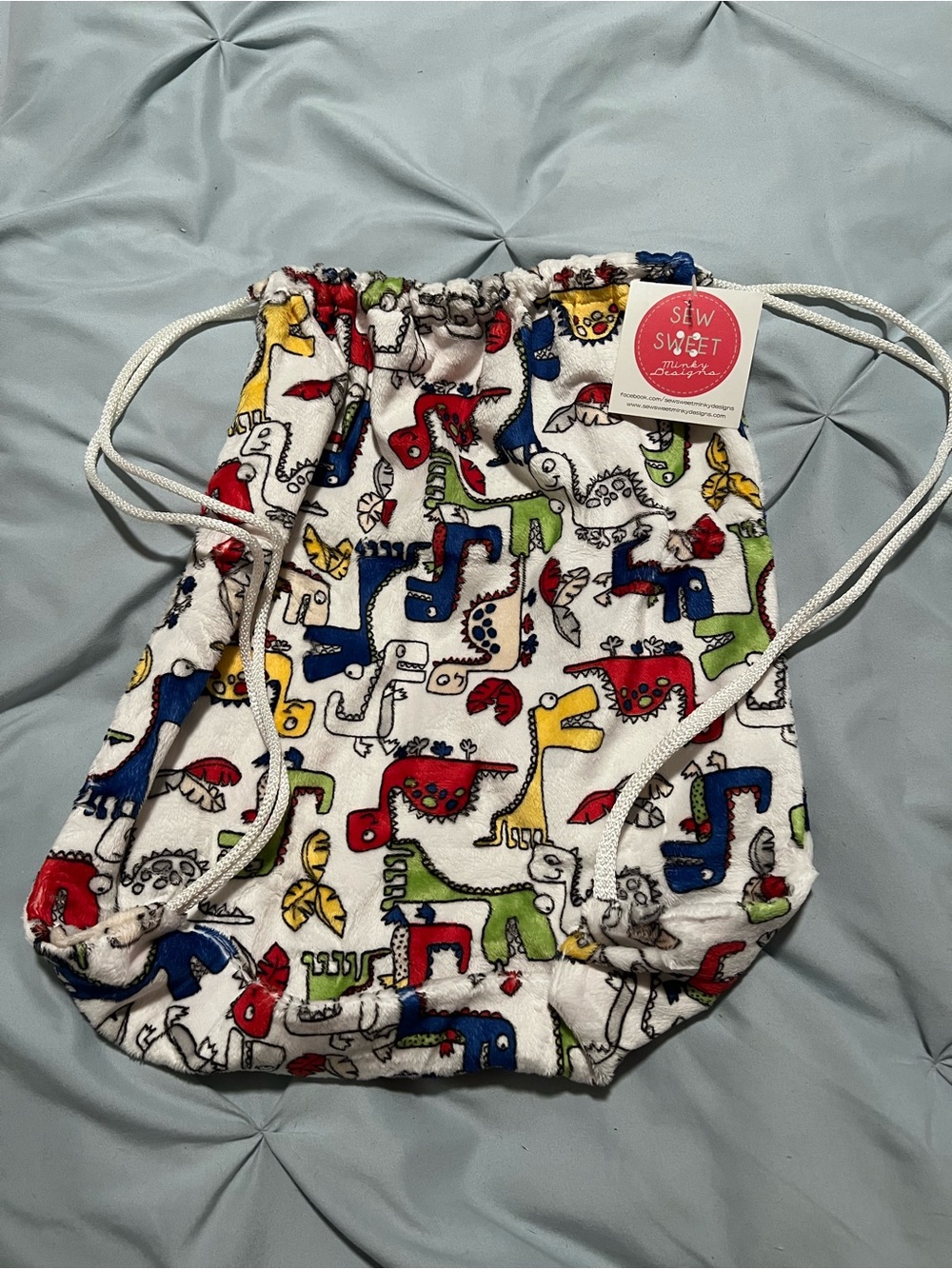 Sew Sweet Kids White Drawstring Backpack with Colorful Dinosaur Print